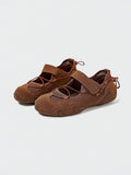 Front-quarter view of brown mesh water shoe with hook-and-loop strap and patterned sole