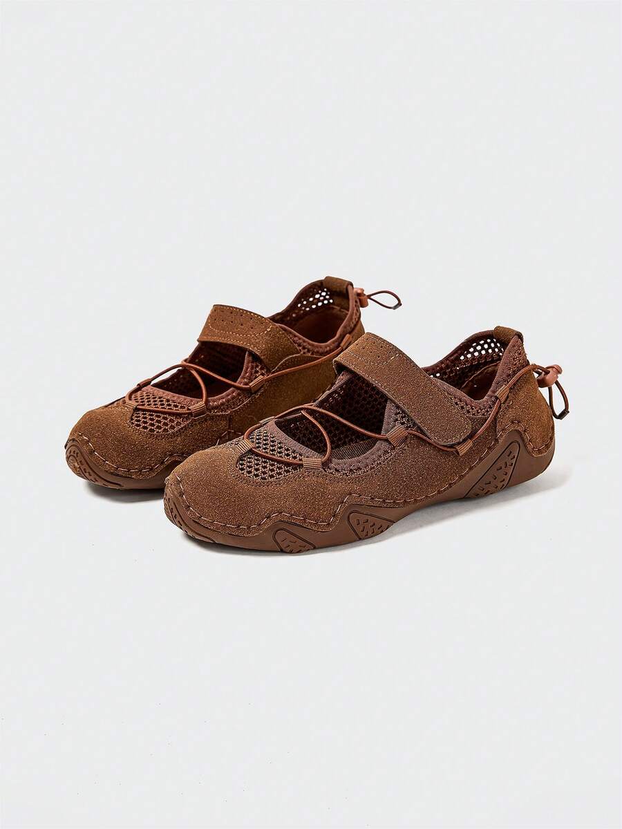 Front-quarter view of brown mesh water shoe with hook-and-loop strap and patterned sole