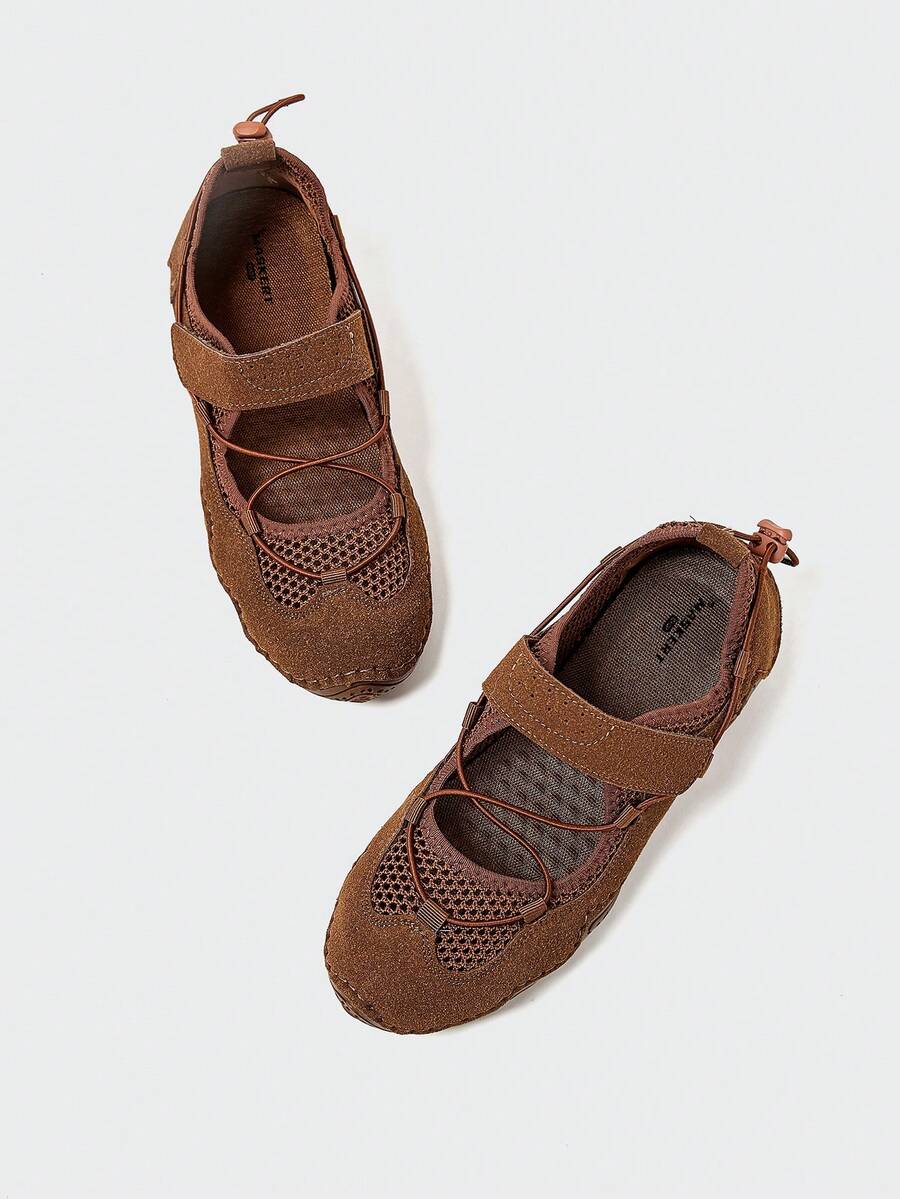 Overhead view of brown rounded-toe water shoe with bungee toggle and mesh panels