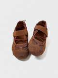 Front-top view of brown adjustable mesh water shoe with textured rubber outsole
