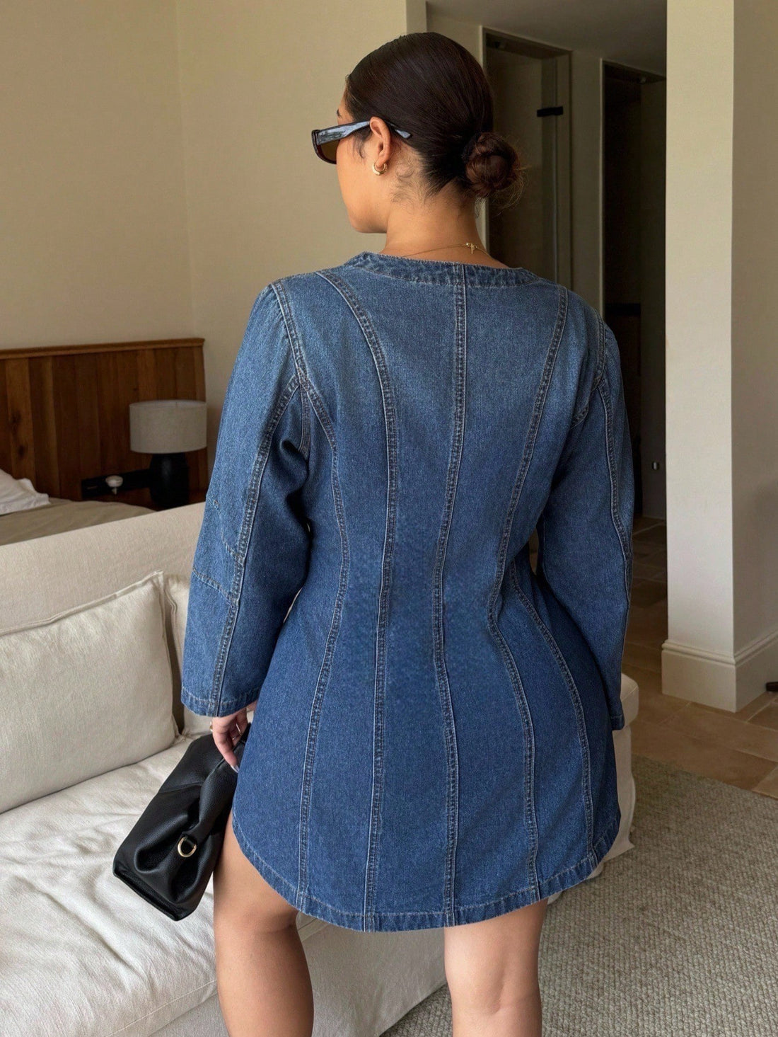 Slip into effortless style with this plus-size denim dress that goes everywhere you do. The classic front button design offers easy layering and a flattering fit, while the relaxed silhouette keeps you comfortable from morning commute to evening plans. Whether you're heading to work, catching a flight, or dancing at a party, this versatile wardrobe staple delivers timeless appeal with a modern edge. Dress it up with heels or keep it casual with sneakers—this denim essential adapts to your vibe and your sche