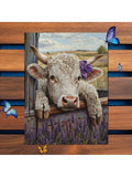 Cute cow wall art with barn window rural field and sky