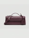 Ostrich embossed structured top handle shoulder bag with flap closure and adjustable strap