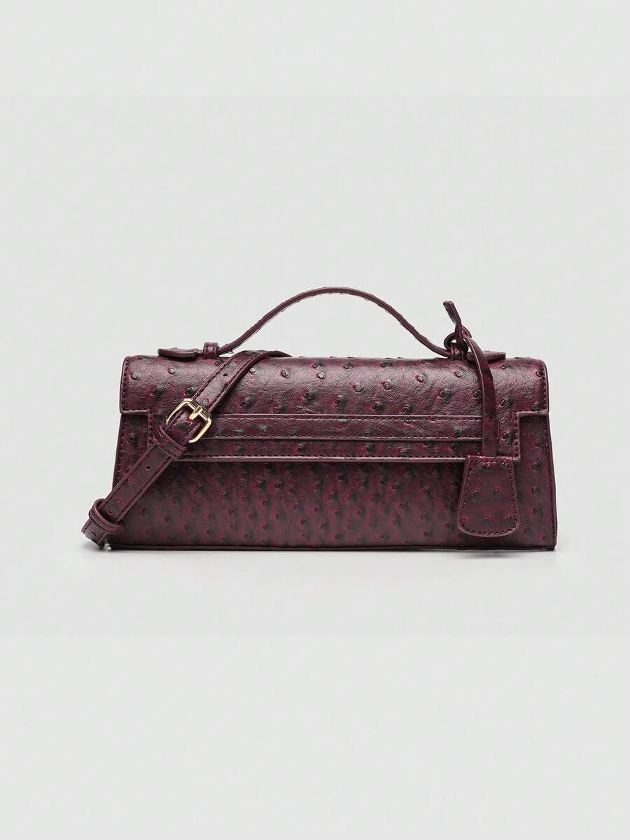 Ostrich embossed structured top handle shoulder bag with flap closure and adjustable strap