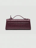 Ostrich embossed structured top handle shoulder bag with flap closure and adjustable strap