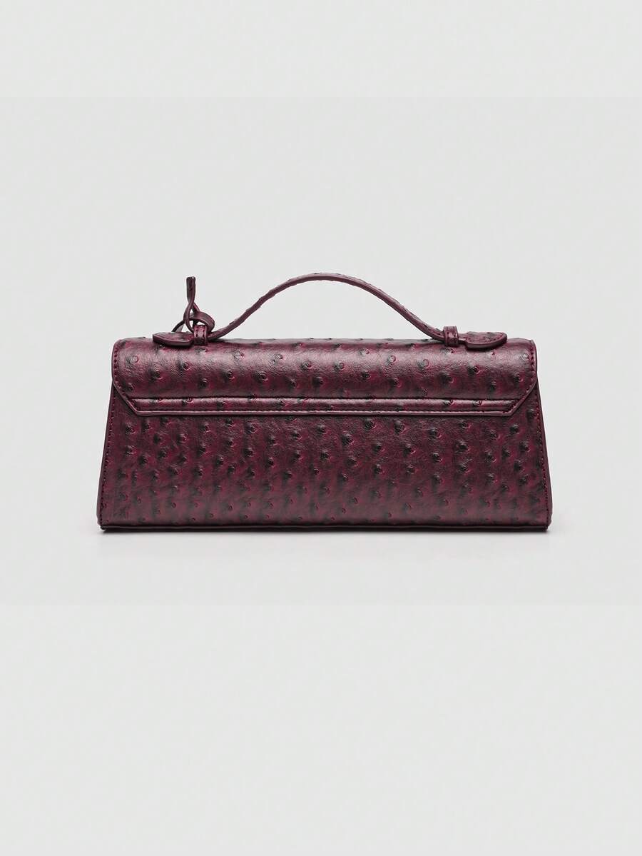 Ostrich embossed structured top handle shoulder bag with flap closure and adjustable strap