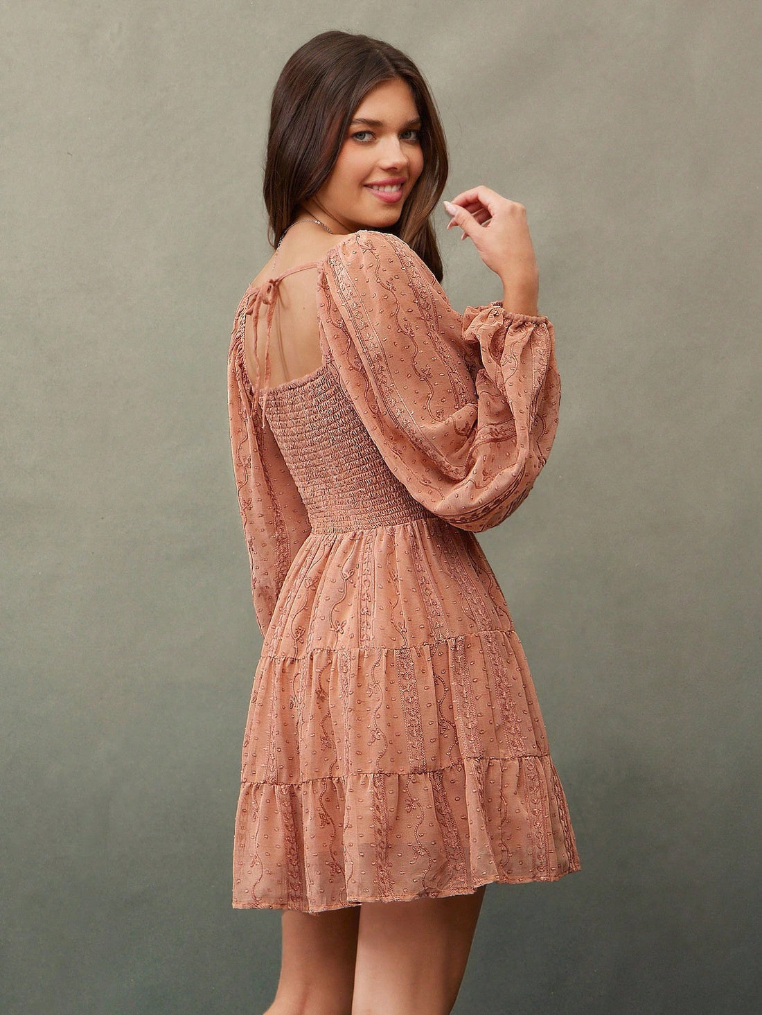 Twirl into autumn with this enchanting mini dress that's equal parts romantic and effortlessly cool. The delicate embroidered chiffon catches light beautifully, while the sweetheart neckline and playful puff sleeves add instant charm. Ruffled details dance along the hem, creating movement with every step. Perfect for layering over tees or pairing with boots, this boho beauty transitions seamlessly from festival vibes to cozy fall gatherings. Embrace your free-spirited style with a dress that feels as good a
