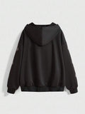 Back view of black oversized zip-up hoodie with graphic sleeve print