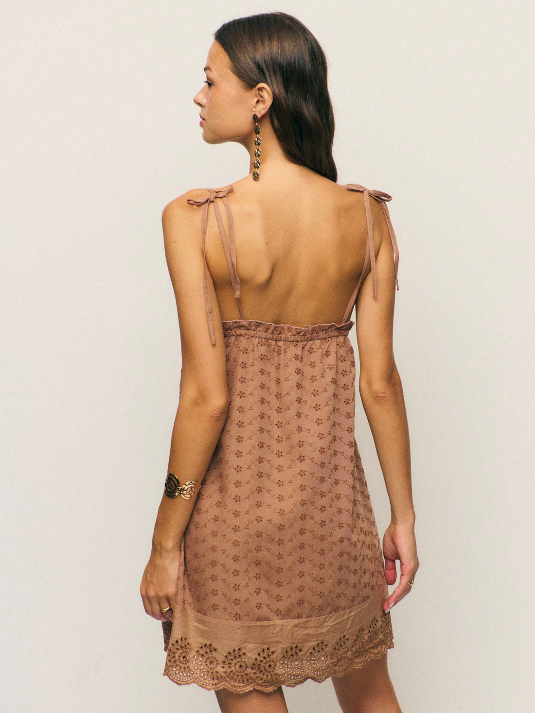 Embrace your inner woodland fairy with this enchanting brown dress that effortlessly blends whimsy with sophistication. Featuring delicate embroidered details and charming eyelet accents, this piece captures the essence of modern fairycore style. The adjustable tie straps offer a flattering fit while the layered silhouette creates beautiful dimension perfect for autumn adventures. Whether you're channeling cottagecore vibes or adding a touch of magic to your everyday wardrobe, this dress is your ticket to l