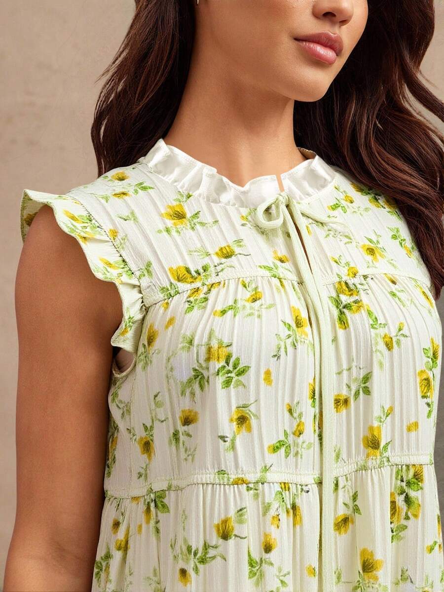 Twirl into autumn with this charming boho mini dress featuring a delicate ditsy floral print that captures effortless, free-spirited style. The adorable bow tie front adds a playful touch that's perfect for fall concerts, casual coffee dates, or weekend adventures. Lightweight and breezy, this dress moves with you while keeping your vibe totally on-trend. Whether you're dancing under the stars or exploring the farmers market, this versatile piece pairs beautifully with sneakers, boots, or sandals for endles