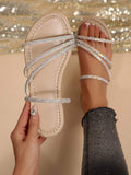 Gold crystal slide sandals with black outsole and open toe design