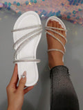 Taupe rhinestone ankle strap flat sandals with square toe and gold buckle detail