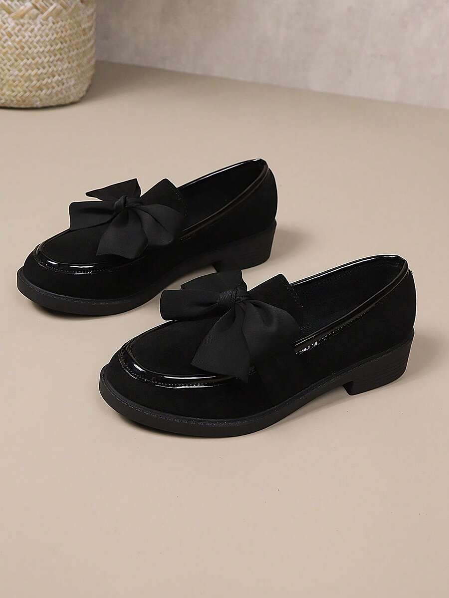 Step into effortless elegance with these striking red bow loafers. Featuring a comfortable slip-on design with a charming oversized bow detail, these flat loafers blend sophistication with everyday wearability. Crafted from durable PU leather with a flexible rubber sole, they're perfect for casual outings throughout autumn and winter. The round toe silhouette and fabric lining ensure all-day comfort, while the classic flat profile works seamlessly with jeans, dresses, or skirts. An ideal choice for adding a