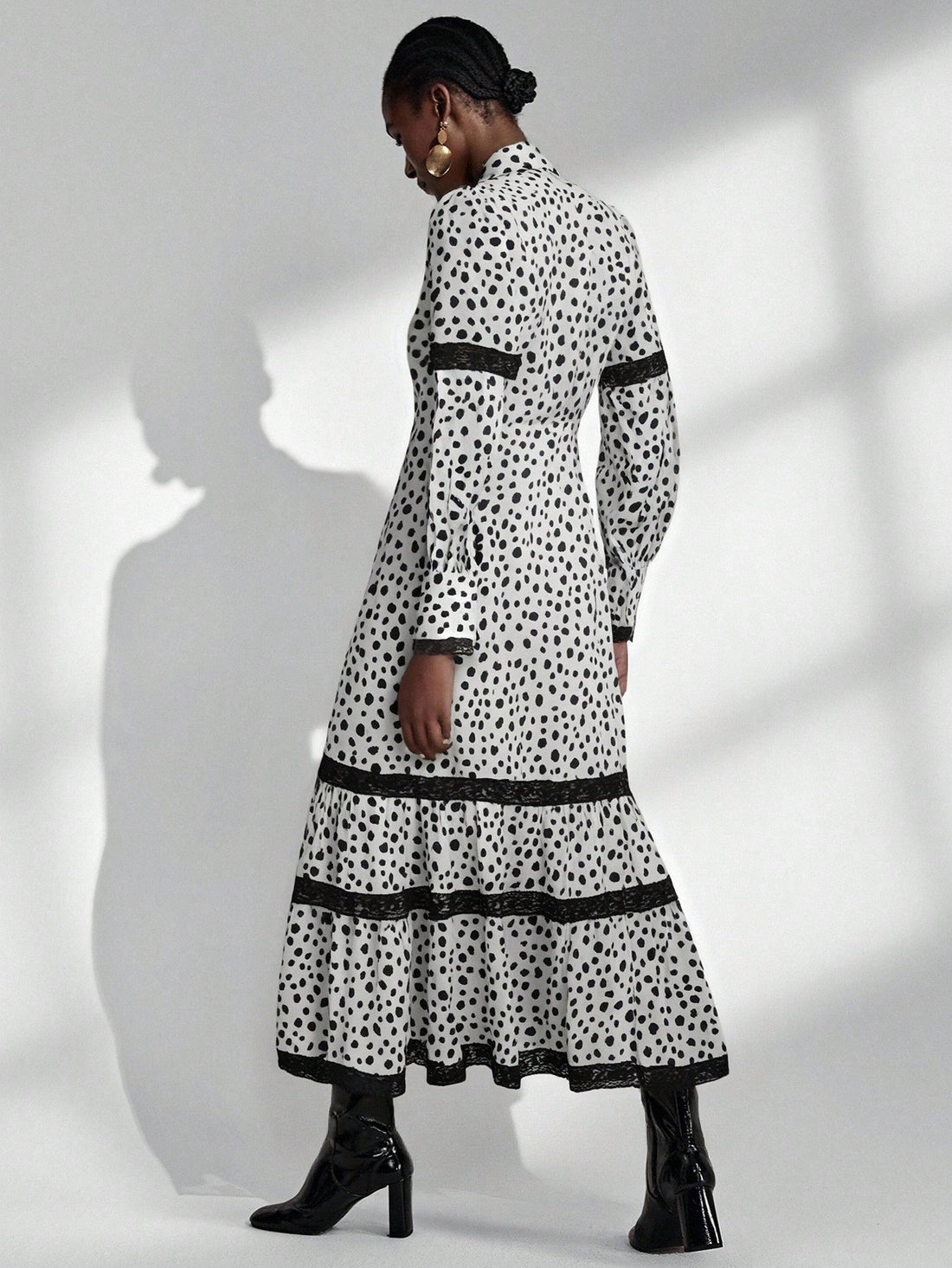 Twirl into timeless elegance with this charming black and white polka dot dress! Featuring delicate lace trim and a flattering flared silhouette inspired by classic French style, this piece effortlessly transitions from casual outings to special occasions. The playful polka dot pattern adds a touch of whimsy while the sophisticated color palette keeps it refined. Perfect for anyone seeking a dress that balances vintage charm with modern flair—because sometimes the sweetest style moments come in the smallest