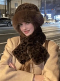 Street-style view of woman wearing leopard faux-fur hat and scarf