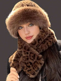 Model wearing brown leopard faux-fur brimmed hat and matching scarf
