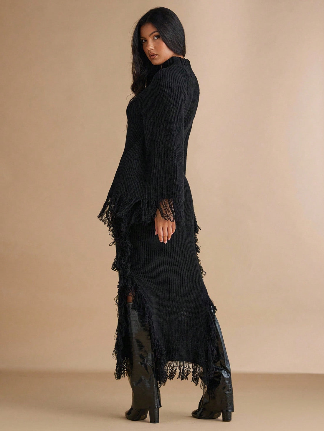 Step into cozy chic with this Elegant Black Fringe Turtleneck Knit Dress. Its soft knit fabric wraps you in warmth, while playful fringe details add flirty movement perfect for autumn adventures. The flattering turtleneck keeps you snug and stylish, making this dress your go-to for sweater weather fun. Dress it up or down easily—comfort never looked this good!