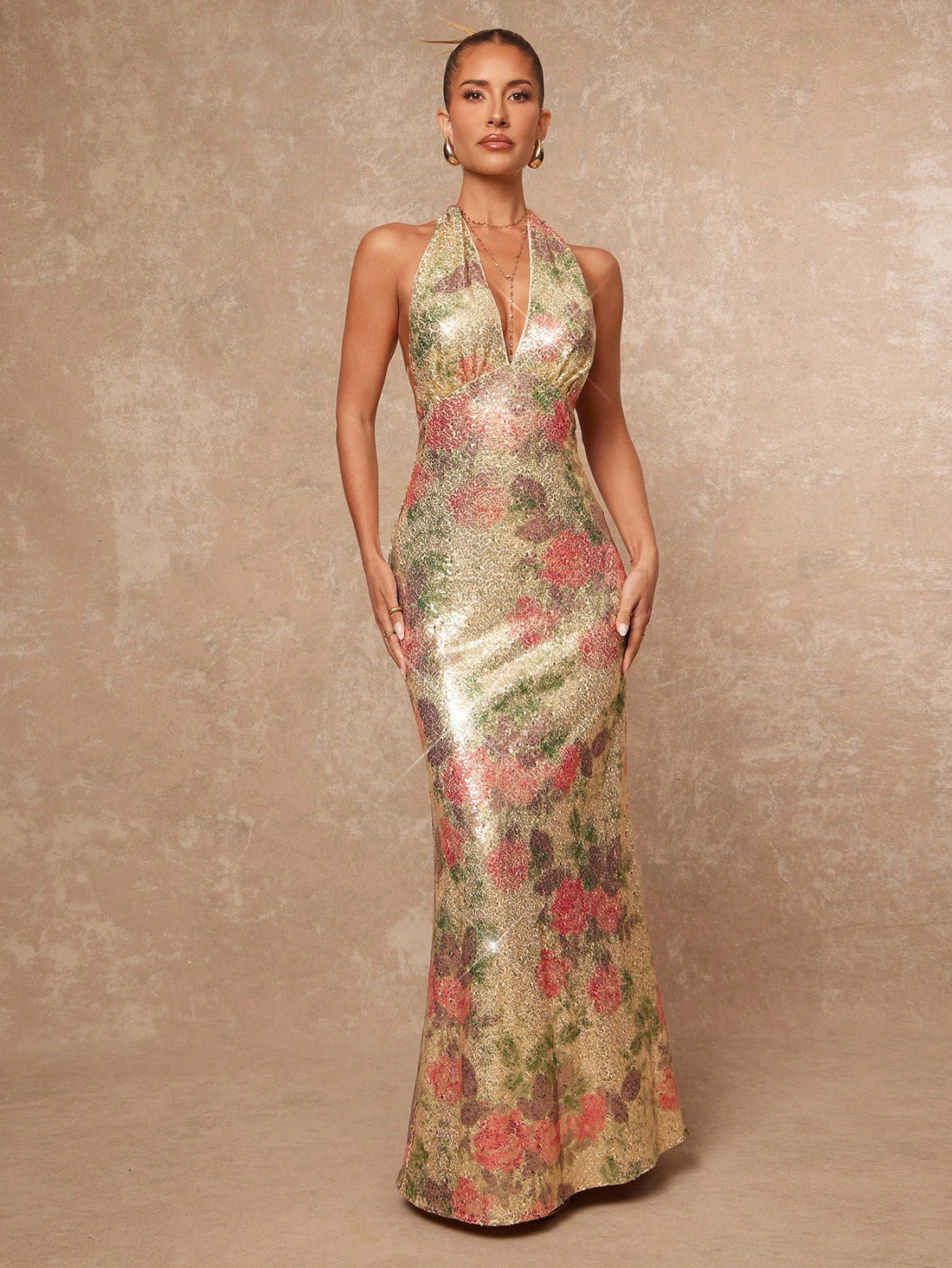 Step into the spotlight with this Elegant Sequin Floral Backless Gown, your perfect partner for turning heads at formal events and holiday parties. Sparkling sequins dance over delicate floral patterns, while the daring backless design adds a flirty touch. Feel confident, festive, and fabulously chic all night long!