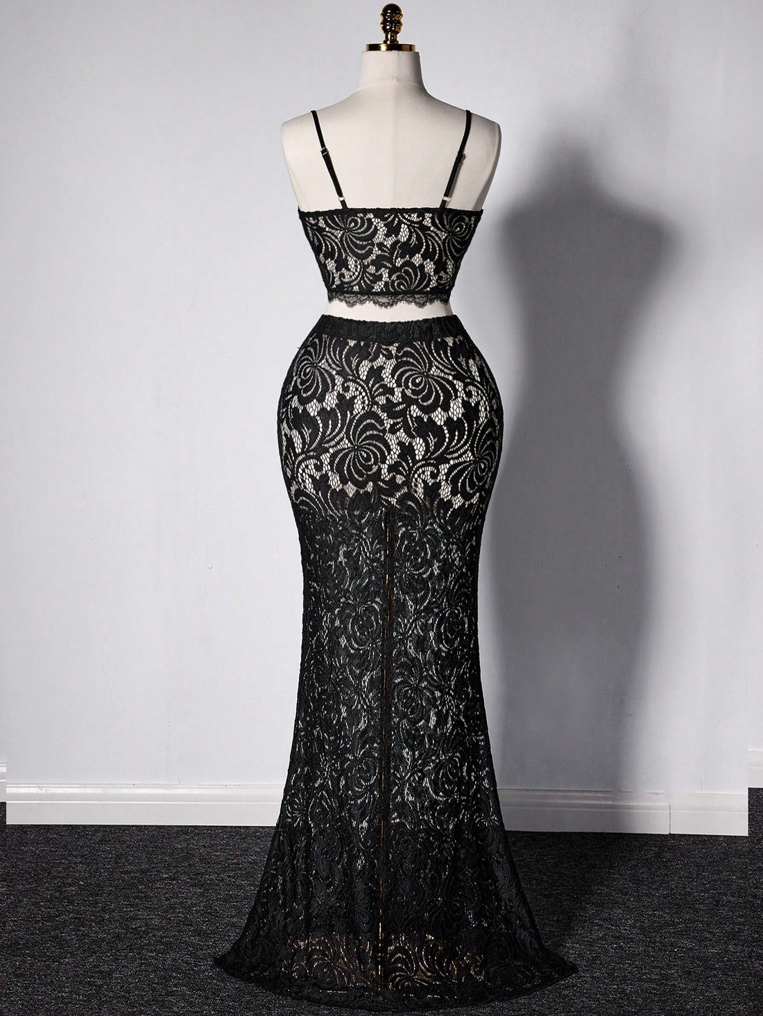 Elevate your summer wardrobe with this fabulous two-piece set designed for confident curves! The delicate sheer lace camisole features a cropped silhouette that flatters your figure, while the flowing fishtail skirt adds dramatic flair and movement. Perfect for date nights, beach getaways, or any occasion where you want to turn heads. This playful ensemble combines elegance with modern edge—because style has no size limit. Slip into sophistication and let your personality shine!