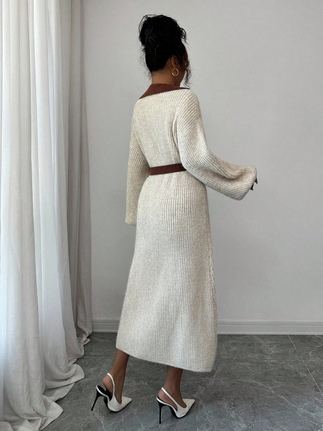 Step into timeless elegance with this charming retro-inspired midi sweater dress. Crafted from soft knit fabric, it features a striking contrast color collar that adds a pop of personality and a cinched waist that flatters your silhouette beautifully. Perfect for creating effortlessly chic looks, whether you're heading to brunch or a casual dinner date. This French-style piece brings vintage sophistication with a modern twist—because looking fabulous never goes out of style.