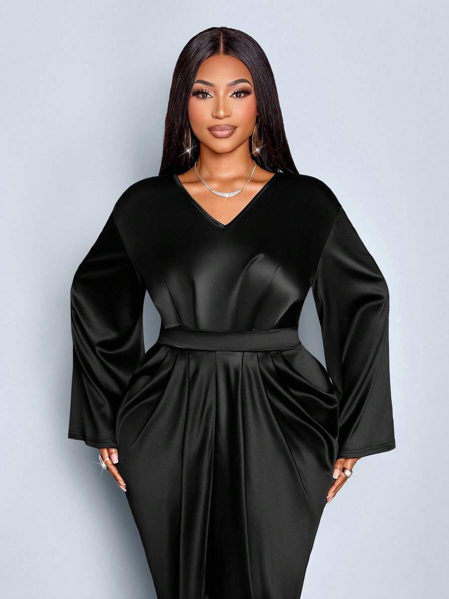 Slip into sophistication with this stunning plus-size satin dress that's ready for anything your calendar throws at you. The luxe V-neckline flatters while the pleated waist creates a beautifully defined silhouette. Flowing to an elegant floor-length hem, this versatile piece transitions seamlessly from boardroom meetings to evening celebrations. The silky satin fabric drapes gorgeously and feels as amazing as it looks. Whether you're commanding a presentation or dancing the night away, this dress delivers 