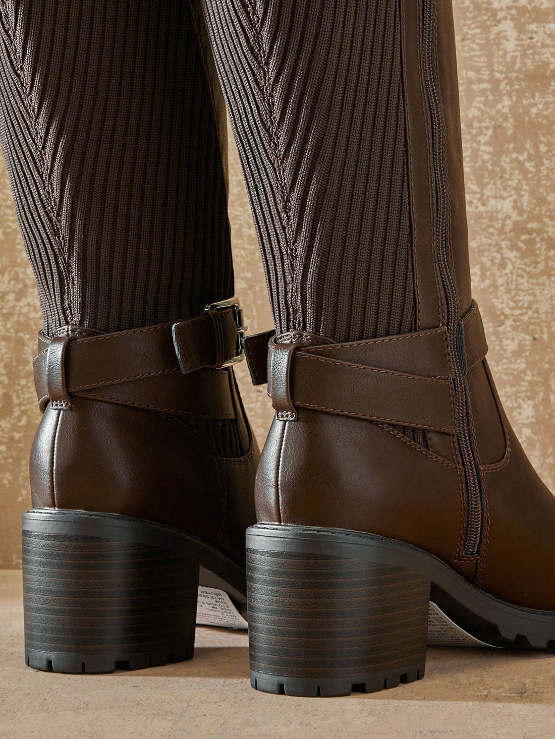 Step into confidence with these chic knee-high boots that blend comfort and style effortlessly. The sturdy block heel keeps you grounded all day long, while the trendy buckled strap adds an edgy touch to any outfit. Whether you're dressing up for a night out or keeping it casual, these versatile boots deliver the perfect balance of support and sass. Elevate your wardrobe with a pair that's as comfortable as it is fabulous!