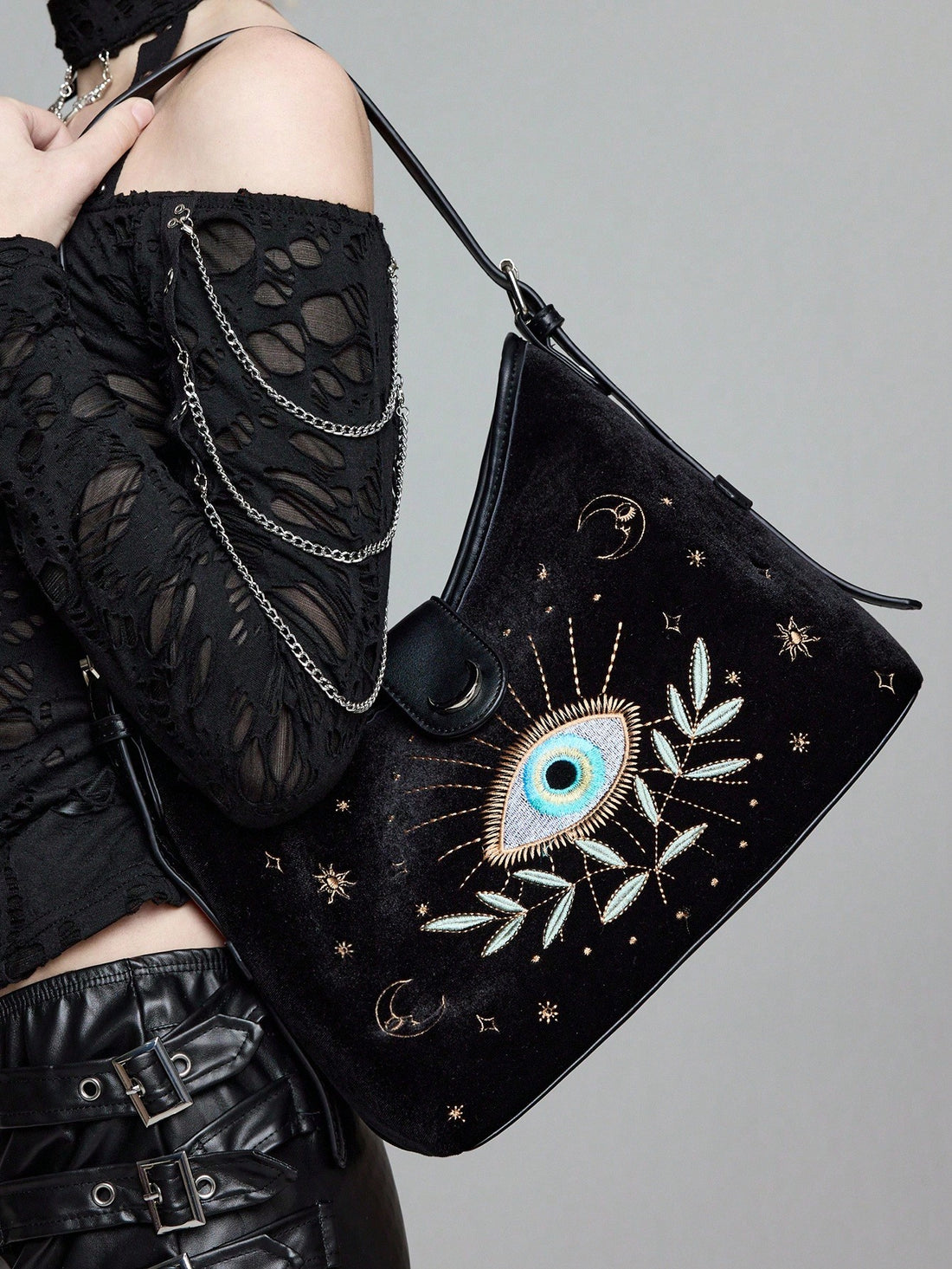 Add a dash of whimsy to your daily routine with this Chic Shoulder Bag featuring quirky eye embroidery. Spacious enough for your essentials yet stylish enough to turn heads, it’s the perfect companion for your daily commutes. Carry your world with a wink!