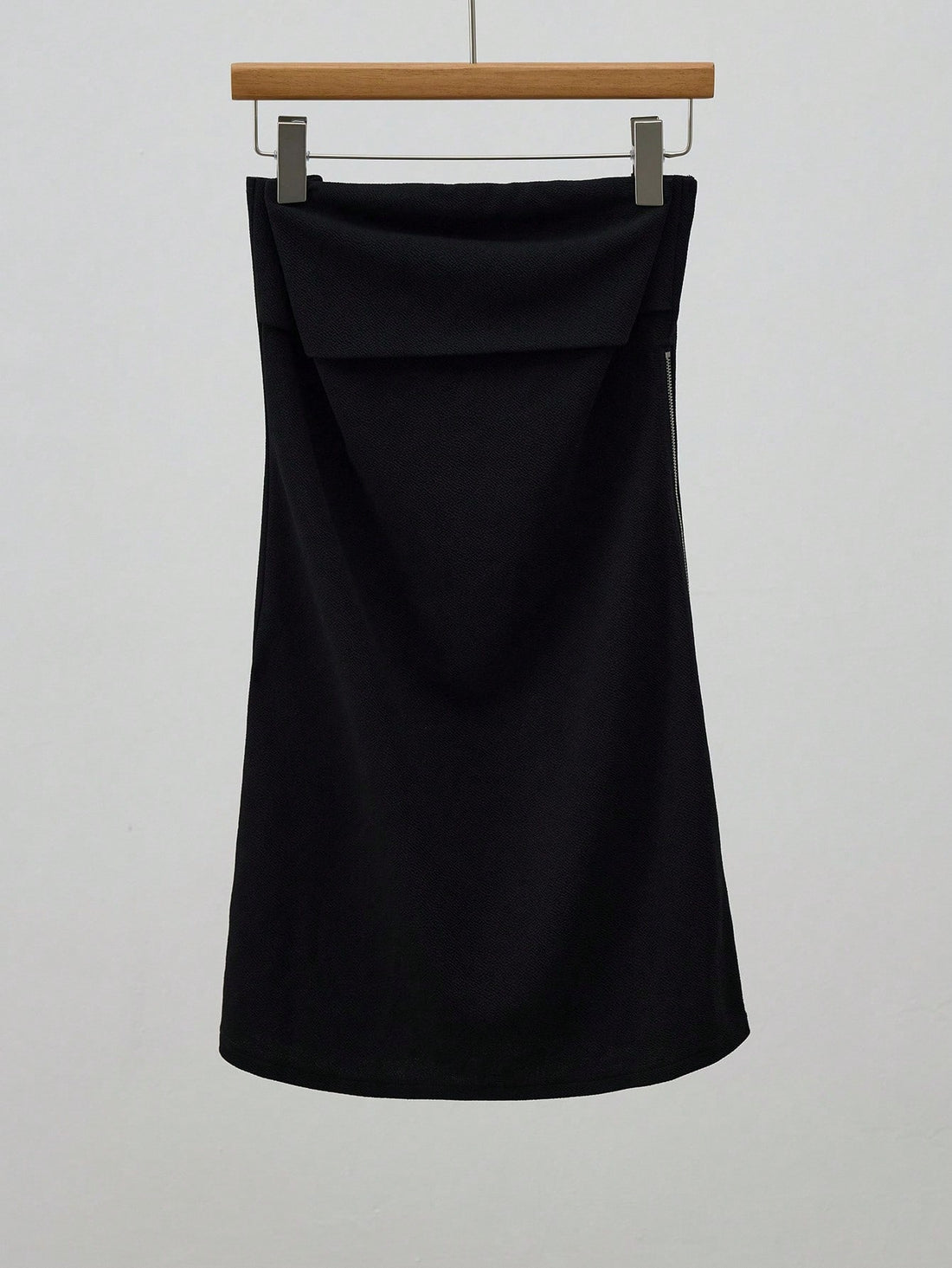 Step out in style with this chic black fitted skirt designed to hug your curves perfectly. Featuring a sleek side zipper for easy wear, this skirt is your go-to piece for turning heads this fall. Playful yet polished, it pairs effortlessly with cozy sweaters or crisp blouses to elevate your seasonal wardrobe. Embrace fall fashion with flair and confidence!