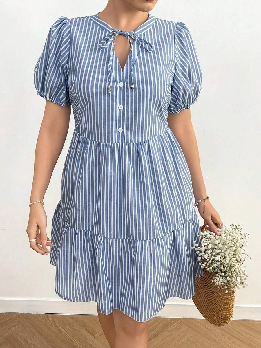 Stripes meet style in this playful plus-size mini dress that's ready to turn heads. The flattering V-neckline and adjustable drawstring create a customizable fit, while the trendy patchwork design adds visual interest and personality. Short sleeves keep things breezy and comfortable, making it perfect for casual outings, weekend adventures, or whenever you want to feel confident and fabulous. Mix and match with your favorite sneakers or sandals for an effortless look that celebrates your unique style.