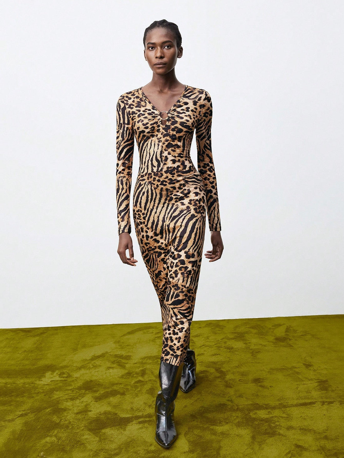 Turn heads with this chic brown leopard print dress designed to hug your curves just right. The long sleeves add a touch of elegance while the fitted silhouette keeps things sexy and playful. Perfect for making a bold statement at any event, this cheetah-inspired piece brings out your wild side with effortless style.