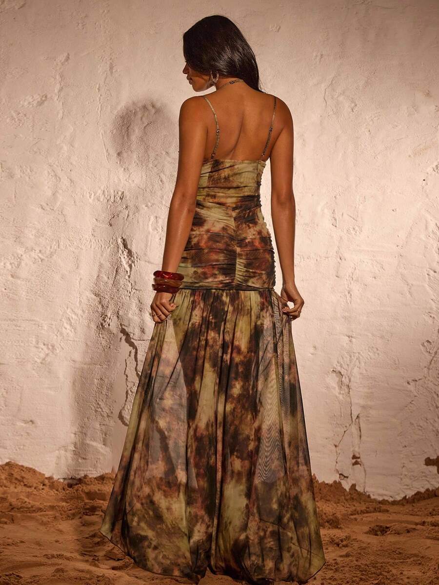 Close view of tie-dye mesh corset bodice and ruched skirt detail