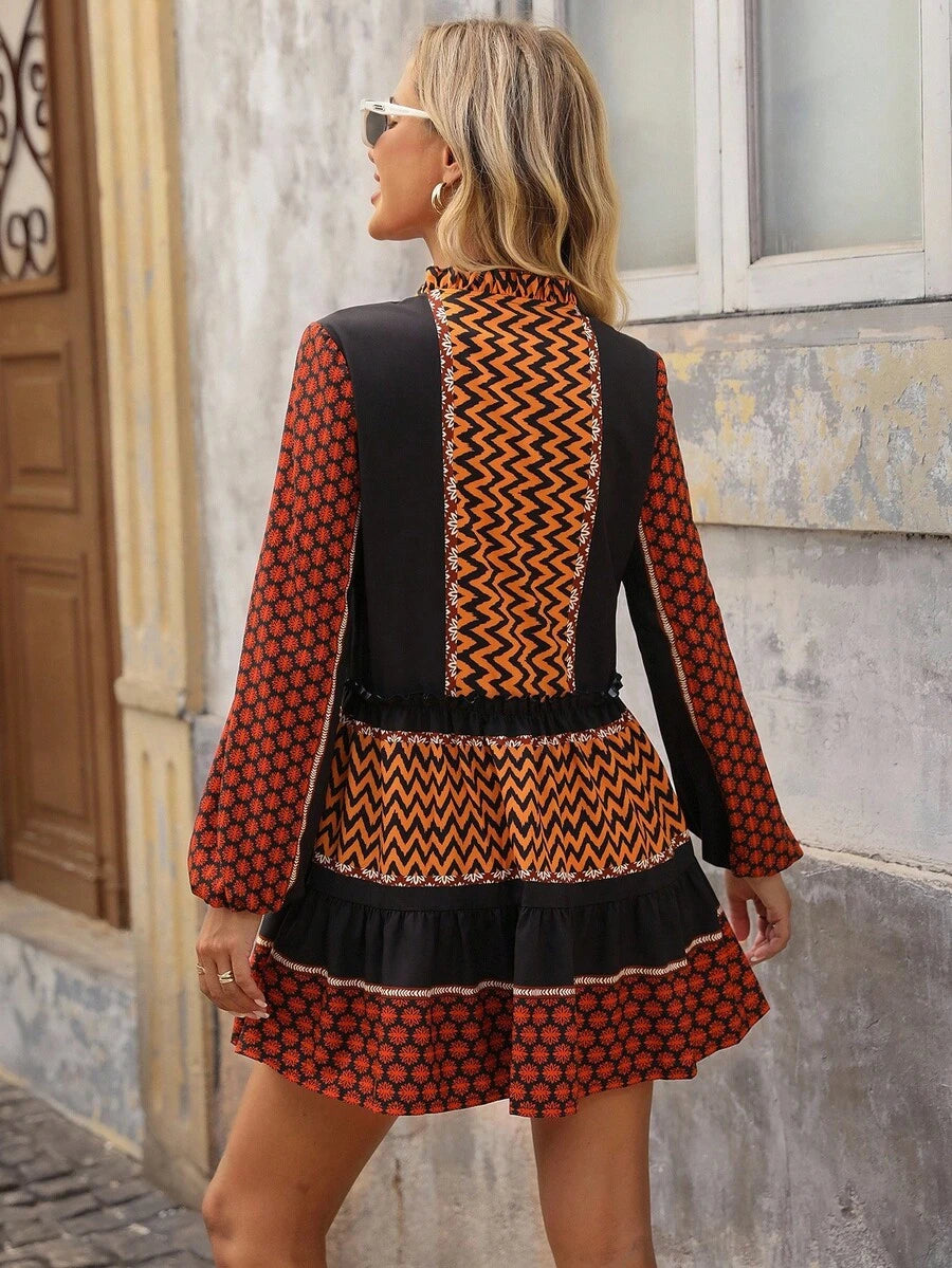 Turn heads on your getaway with this eye-catching mini dress featuring bold geometric prints that pop. The playful lantern sleeves add a flirty touch while the ruffled hem brings movement and personality to every step. Perfect for casual vacation vibes, beach strolls, or spontaneous adventures—this dress effortlessly transitions from day to night. Lightweight and fun, it's your new go-to piece for making a statement without trying too hard.