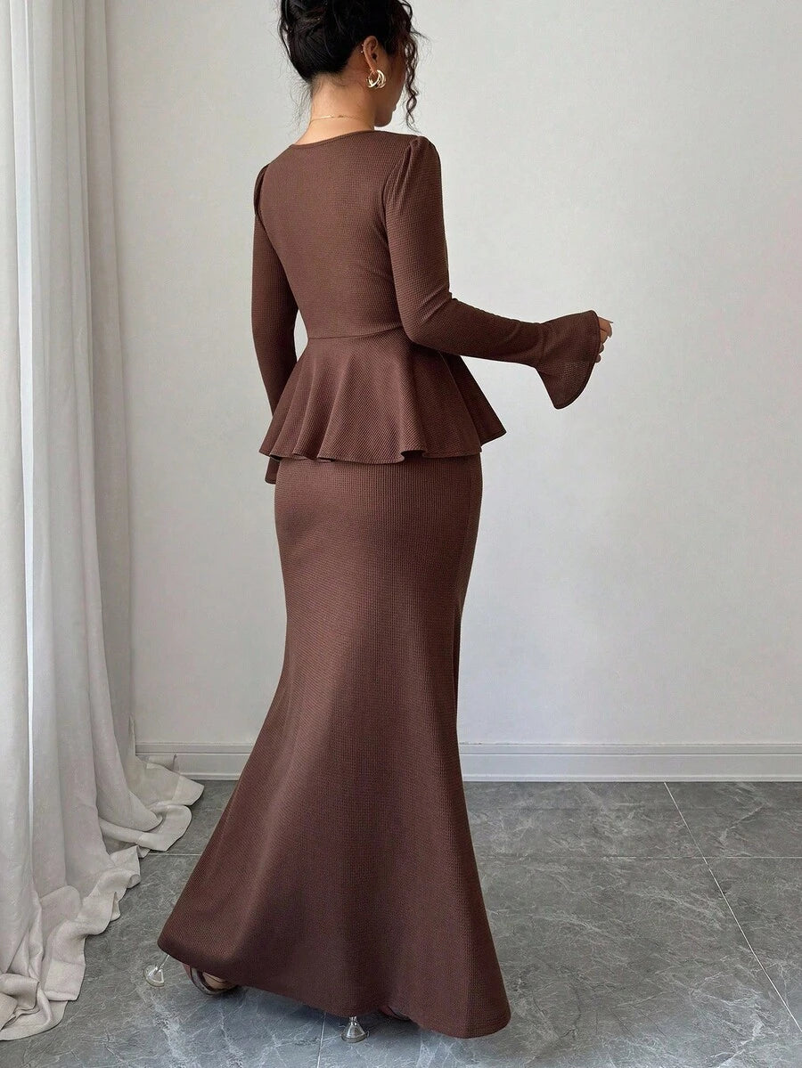 Elevate your wardrobe with this effortlessly chic French-inspired two-piece set. The deep brown fitted top features a flattering V-neckline and charming flared sleeves that add movement and sophistication. Pair it with the graceful mermaid hem skirt for a look that's equal parts elegant and fun. Perfect for date nights, brunch outings, or whenever you want to channel timeless European style with a modern twist. This set proves that looking polished doesn't mean sacrificing personality.
