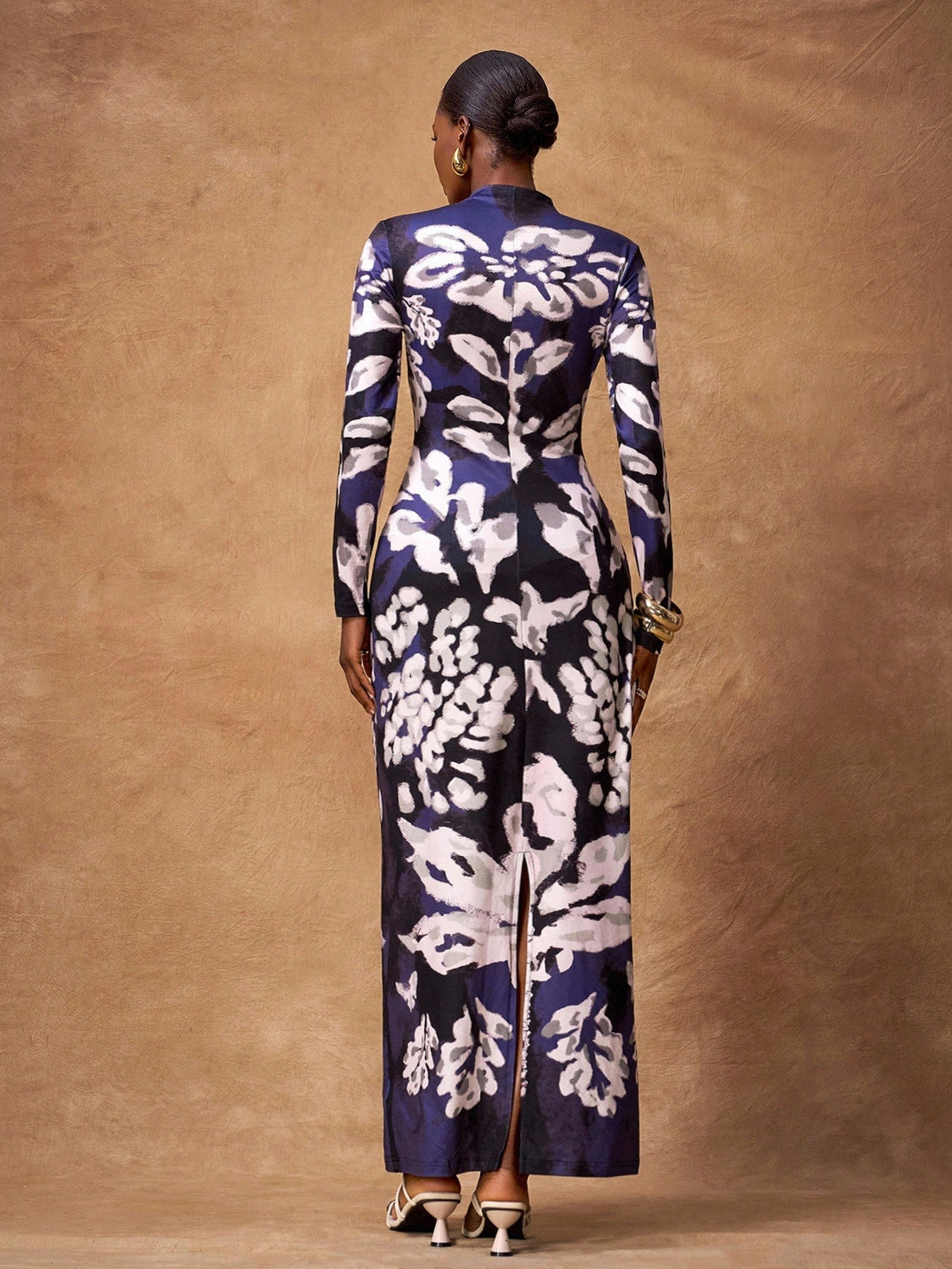 Step back in time with this stunning retro maxi dress that effortlessly blends vintage charm with modern sophistication. Designed for the fashion-forward woman, this dress features a flattering silhouette that works beautifully through fall and winter months. Whether you're heading to a special occasion or elevating your everyday style, this piece delivers timeless elegance with a playful twist. The flowing maxi length and classic retro details make it a versatile wardrobe essential that'll have you feeling