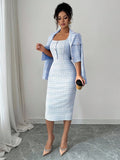 Back view of blue tweed cropped blazer and fitted dress