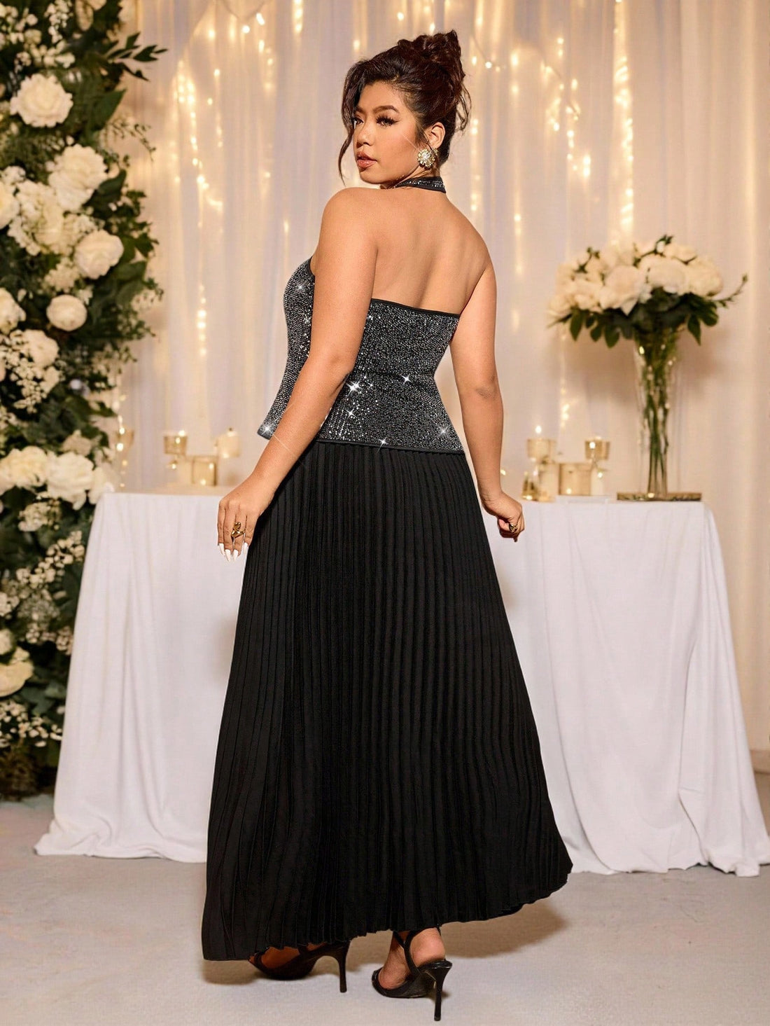 Get ready to shine in this Elegant Plus Size Black and Silver Sequin 2-Piece Party Set for Women. With its stunning sequins and flattering fit, this party set is a must-have for any stylish and confident woman. Perfect for any special occasion, you'll be the life of the party in this chic and glamorous ensemble.