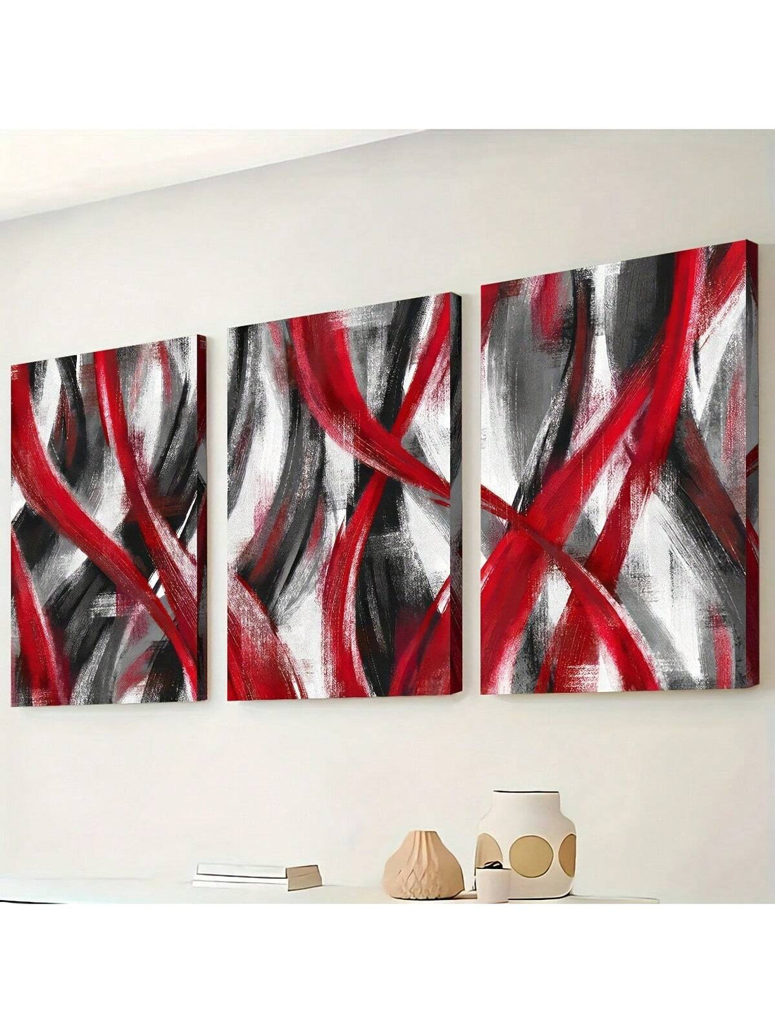 Add a bold splash of color and style with this 3-piece red and black geometric wall art set. These abstract canvases bring vibrant energy and modern flair to any home, office, or living space. Perfect for those who love striking designs that spark conversation and brighten up your walls with a playful edge.
