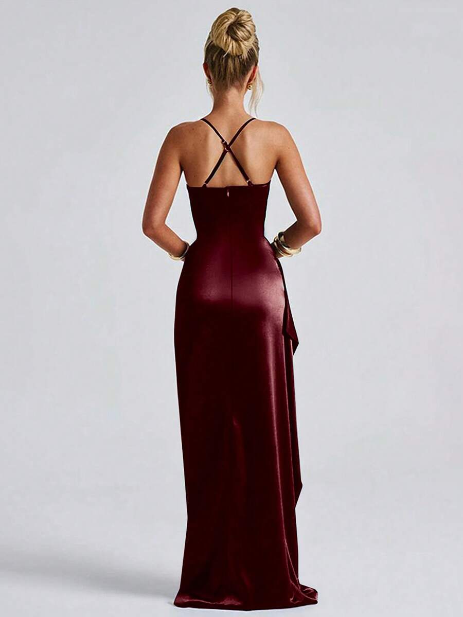 Burgundy satin gown back view showing crossed straps and floor-length silhouette