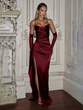 Burgundy satin gown front view with fitted bodice and side slit, styled with gloves