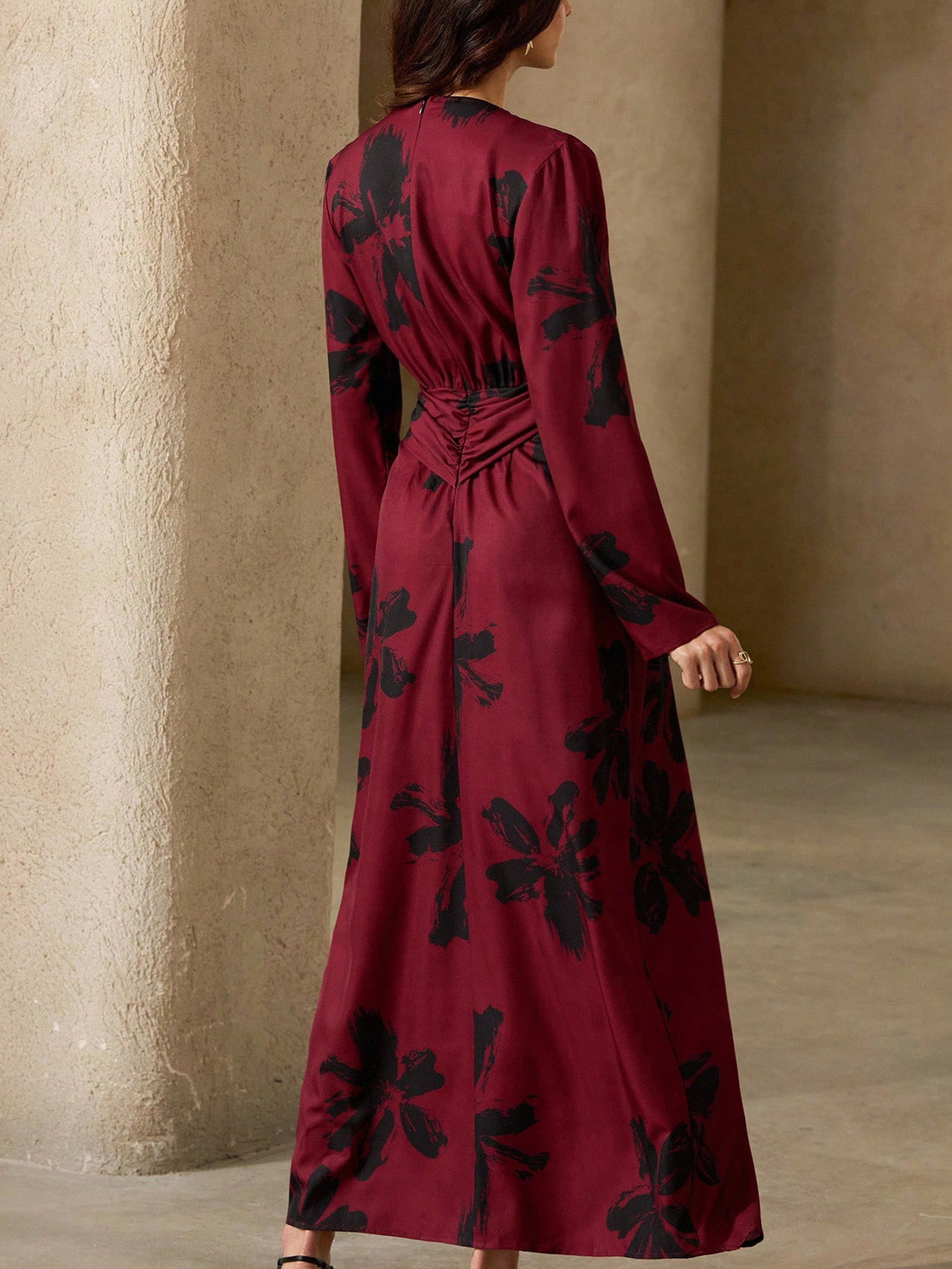 Make a statement in this playful red and black floral maxi dress designed to turn heads. Its deep V-neck adds a flirty touch, while the tie knot detail cinches your waist for a flattering fit. Flowing fabric keeps you comfortable and effortlessly chic, perfect for sunny days or evening fun.