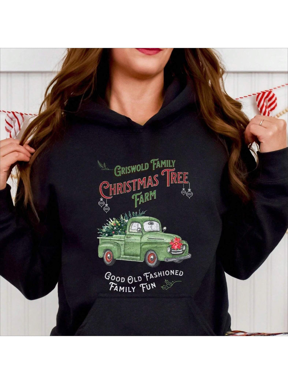Celebrate the holiday season in style with the Oversized Griswold Family Christmas Tree Hoodie. This cozy sweatshirt brings festive cheer inspired by the iconic family Christmas tree, offering both comfort and nostalgic charm. Its relaxed fit ensures warmth during chilly winter days, making it the ideal choice for holiday gatherings or casual wear. Crafted for durability and festive spirit, this hoodie transforms your holiday wardrobe with a touch of classic holiday humor and warmth.