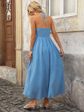 Back view of aqua blue boho halter maxi dress with open back and halter tie