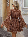 Brown paisley boho mini dress back view with flared sleeves