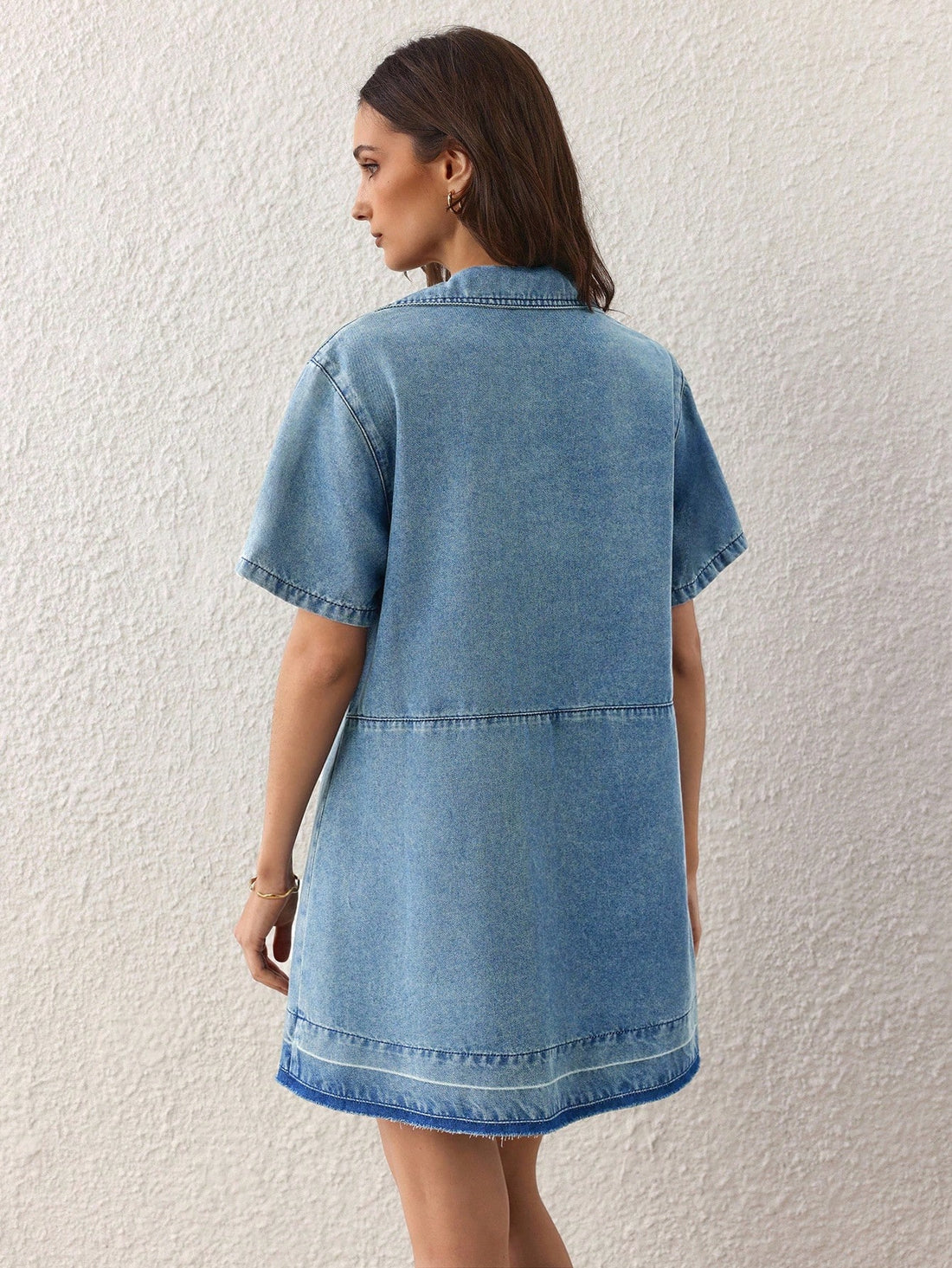 Elevate your denim game with this charming dress that's equal parts sophisticated and fun. Crafted from classic denim, it features a polished lapel collar and adorable faux pearl embellishments that add just the right amount of sparkle to your everyday look. The short sleeves keep things breezy and comfortable, while the structured silhouette flatters every frame. Perfect for casual outings, weekend brunches, or whenever you want to look put-together without trying too hard. This is the dress that makes get