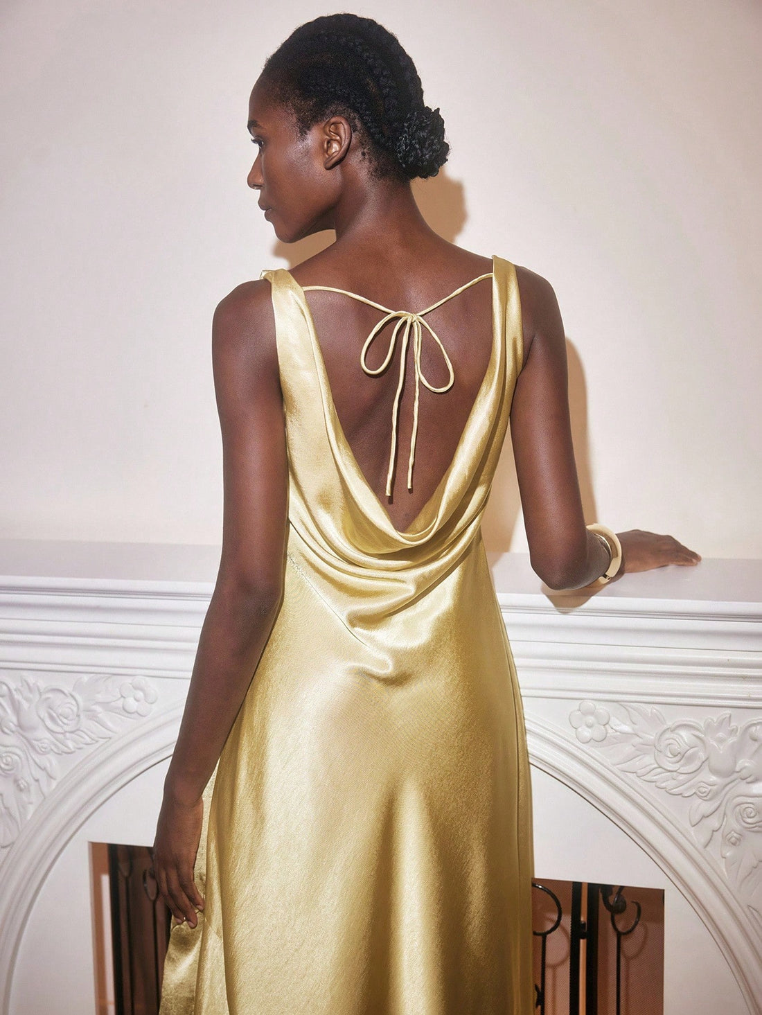 Step into the spotlight with this elegant solid color backless dress, designed to turn heads at any party. Its sleek silhouette and daring back detail combine sophistication with a flirty twist. Feel confident and comfortable as you dance the night away wearing this effortlessly chic piece made to celebrate your bold style.