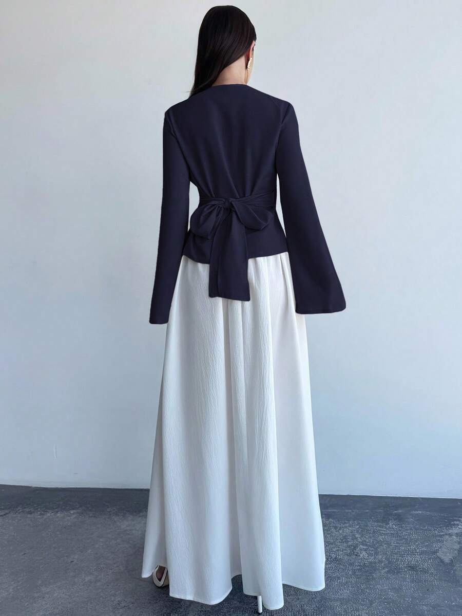 Elevate your wardrobe with this charming two-piece set that effortlessly transitions from office to date night! The wrap waist blouse features flattering draping that cinches at just the right spot, while flare sleeves add a touch of romantic flair. Pair it with the flowing long skirt for a polished, put-together look that turns heads. Crafted in a versatile khaki tone, this set works beautifully with your favorite accessories and shoes. Whether you're impressing at work or stealing hearts over dinner, you'