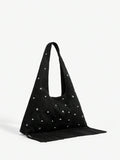 Black hobo bag side angle with fringe tassel detail