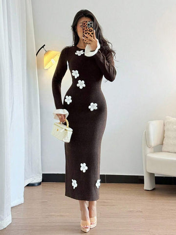 Front view of coffee brown rib knit bodycon midi dress with white 3D floral appliques and flared cuffs