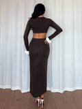 Back view of coffee brown fitted rib knit dress with long sleeves and white flared cuffs