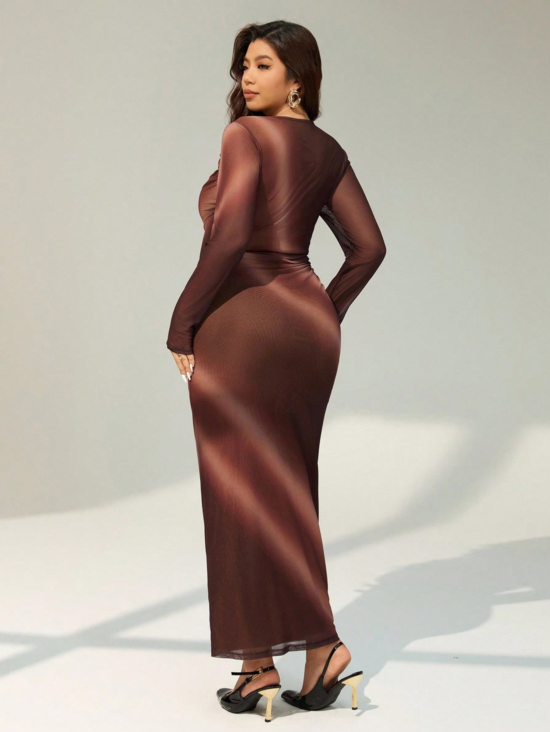 Wrap yourself in autumn sophistication with this stunning plus-size dress that's equal parts cozy and chic. The long sleeves keep you warm while the flattering hip wrap design cinches at all the right places, creating a silhouette that feels as good as it looks. Rich brown tones pair perfectly with everything in your fall wardrobe, making this your go-to piece for everything from casual coffee dates to dinner out. Comfort meets style in a dress designed to make you feel fabulous, no matter the occasion.